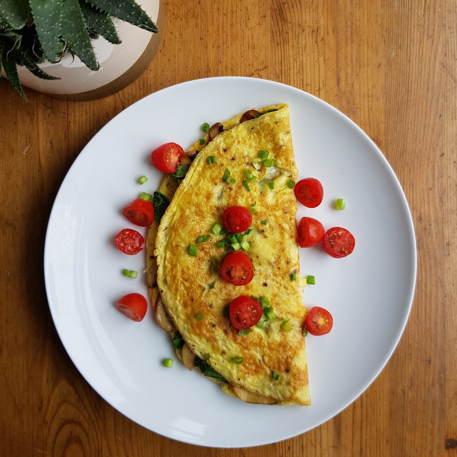 Cheesy spinach and mushroom omelette recipe by FitFreshBites